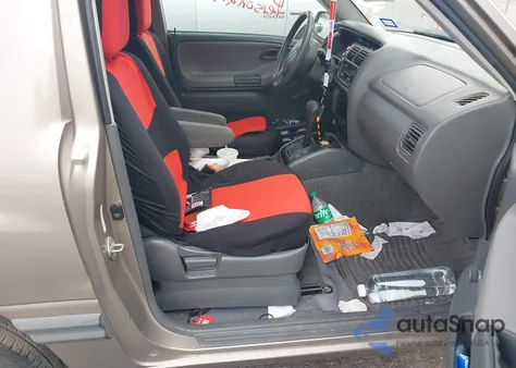 2003 Chevrolet Tracker from USA, damaged, VIN 2CNBE18C736933139